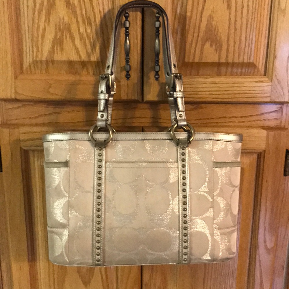 Gold coach bag